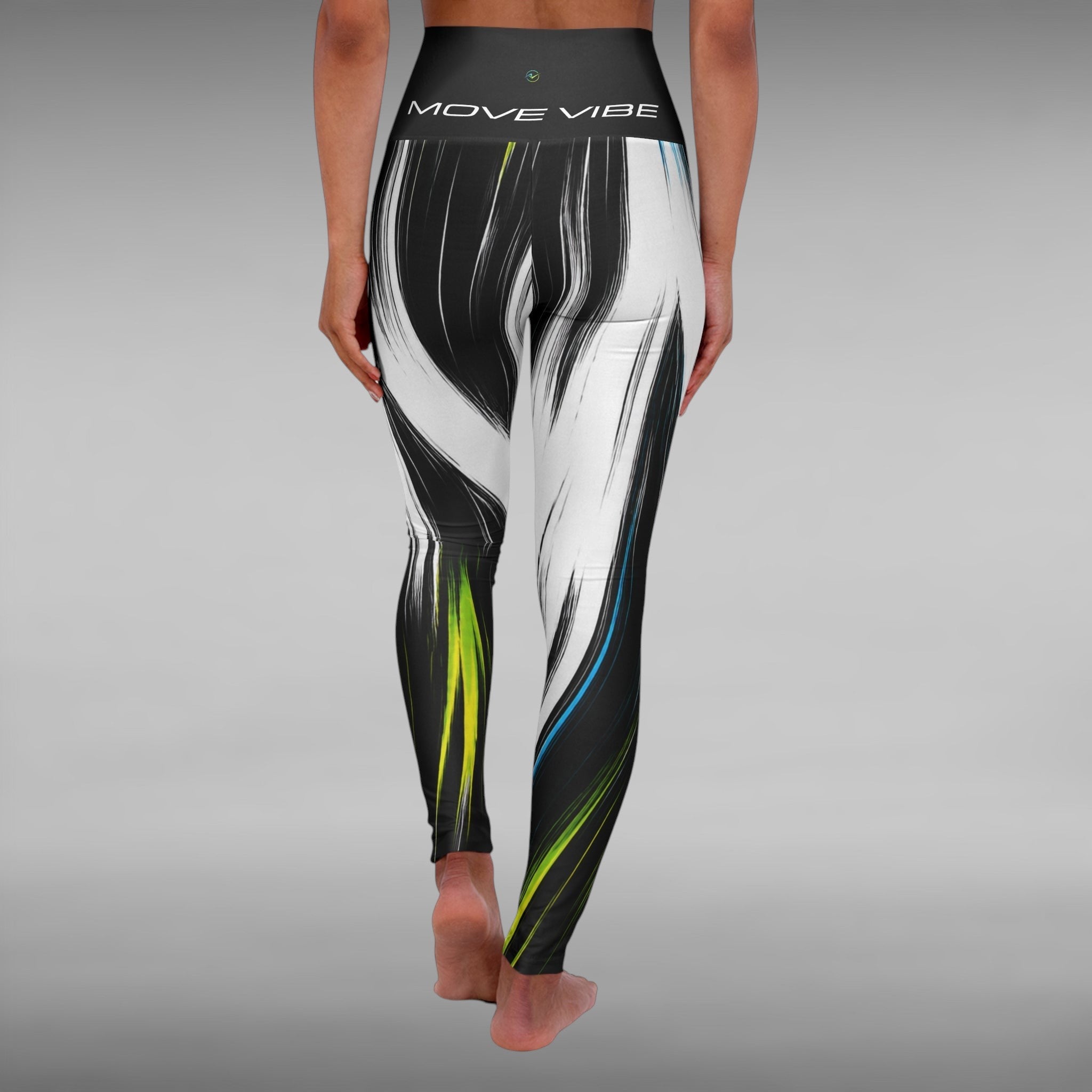 Move Vibe high-waist yoga leggings featuring a black and white brushstroke print with neon blue and green accents.