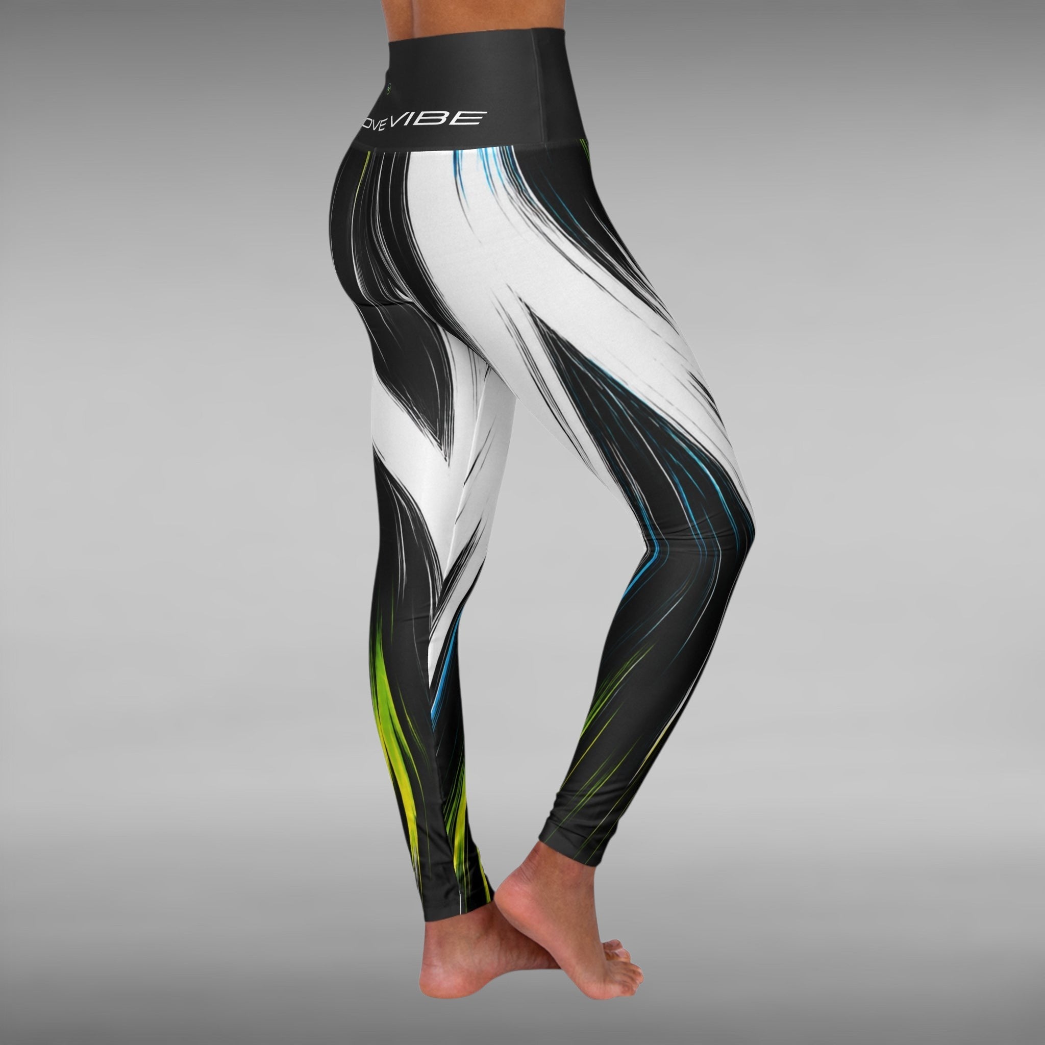 Move Vibe high-waist yoga leggings featuring a black and white brushstroke pattern with electric blue and neon green accents