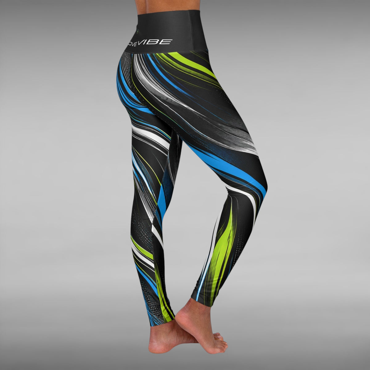Move Vibe high-waisted yoga leggings featuring a blue, lime, and white swirl print on a black background.