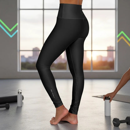 Move Vibe black high-waist yoga leggings with a supportive double-layer waistband and subtle leg wordmark branding.