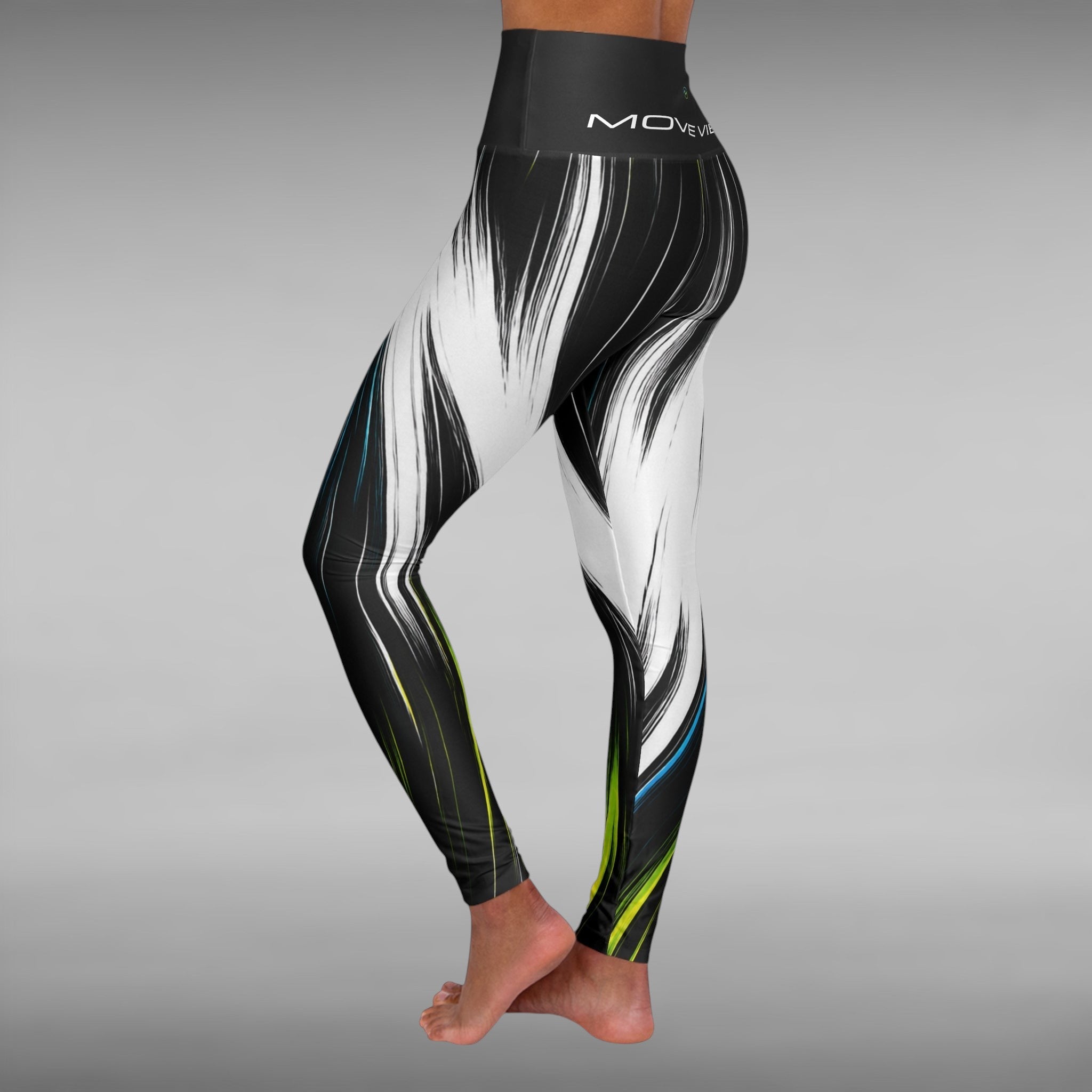 Move Vibe high-waist yoga leggings featuring a black and white brushstroke print with neon green and blue accents.