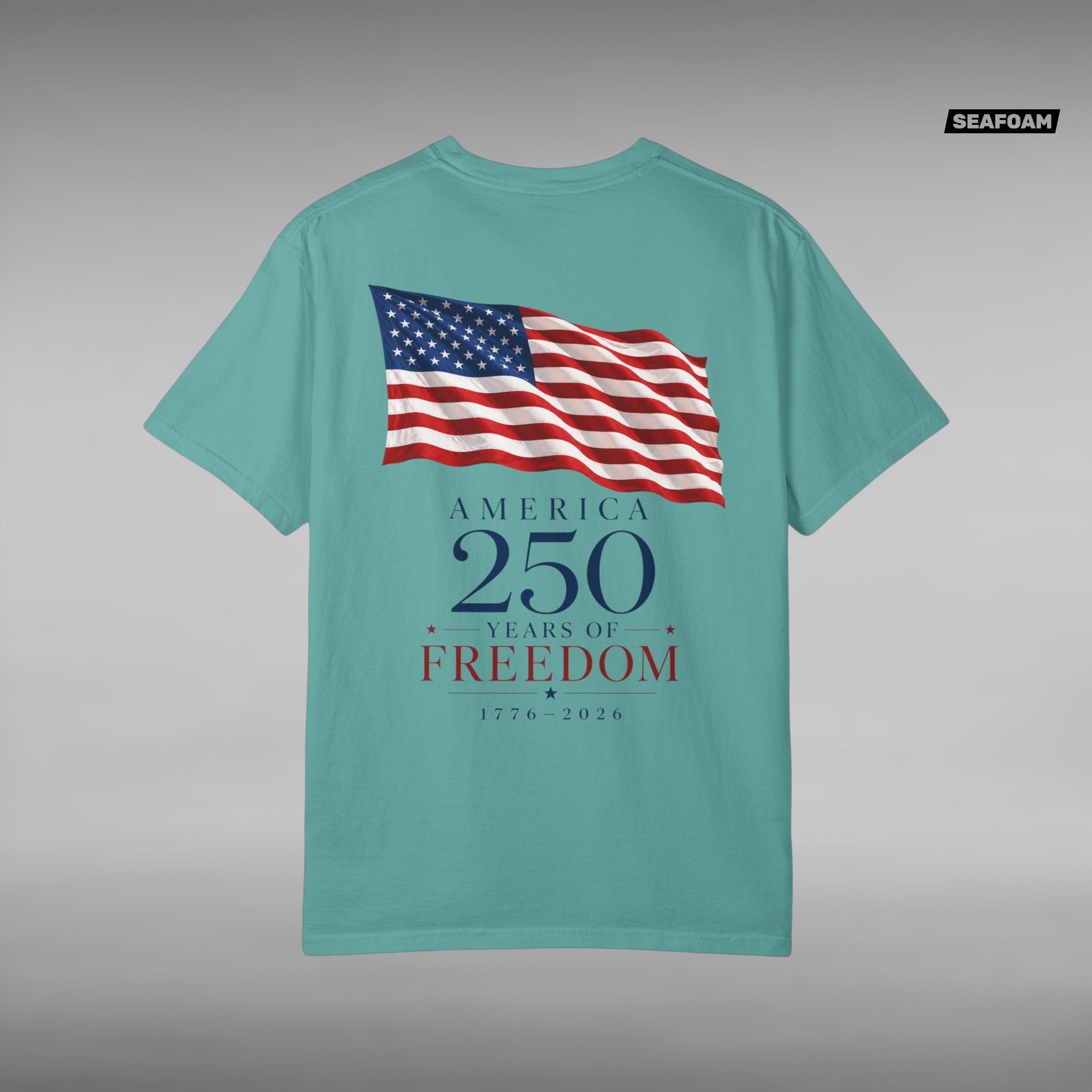 Move Vibe teal garment-dyed cotton t-shirt featuring a back print of a waving American flag and America 250 text.